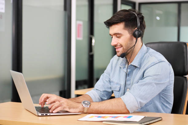 istock Caucasian businessman IT operator answering online phone call from customer as 24/7 customer service 1272251815