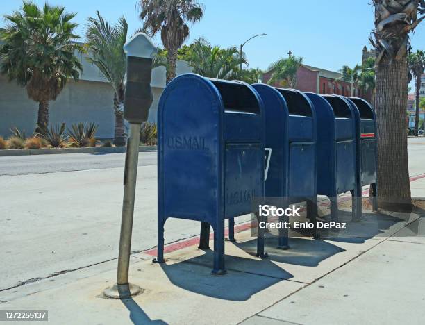 Four Mailboxes On The Sidewalk Stock Photo - Download Image Now - Mailbox, United States Postal Service, Voting by Mail