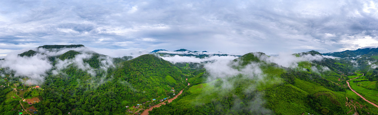 Panorama of aerial view on mountains with green jungle in Nan province, Thailand.