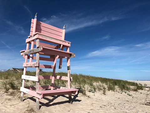 A Pale Pink Lifeguard Chair on the Beach in Westhampton Beach, Long Island, New York.