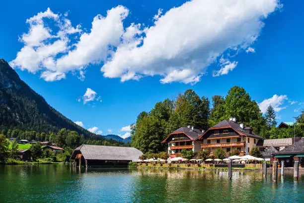 Lake Koenigssee with buildings and trees in the Berchtesgaden Alps, Germany.