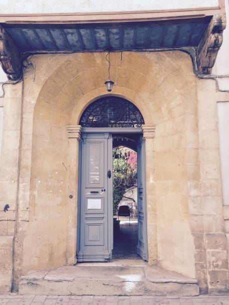 istock Archway and door with courtyard beyond 1272262105