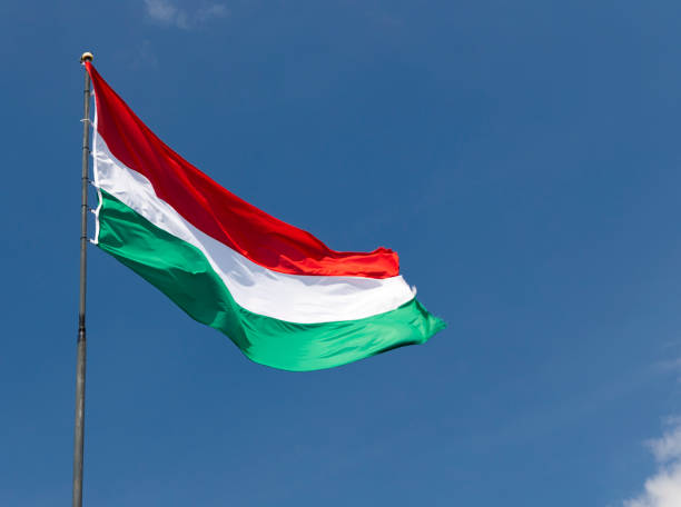 istock Hungarian flag on blue sky 1272263022