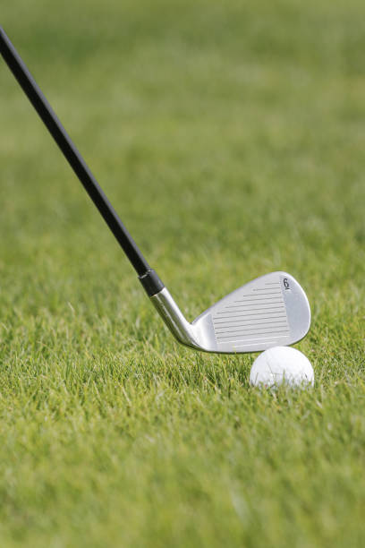 istock Golf ball in golfer's hand 1272264211