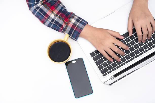 istock man hands working on keyboard laptop on white table, top view 1272266915