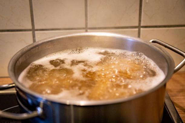 istock pot with boiled water and pasta, spaghetti 1272269486