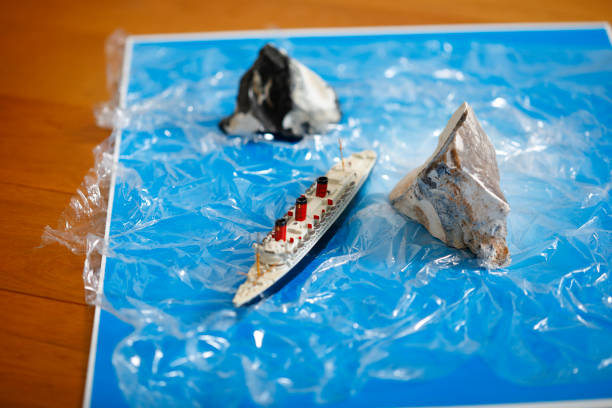 Tabletop shot with homemade model of a passenger ship and two flints