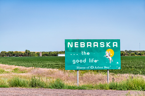 Hebron, United States - August 15, 2020:  The sign at the border between Kansas and Nebraska welcoming travelers to the state of Nebraska.