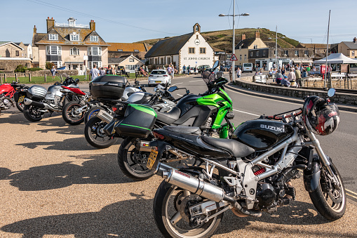 West Bay, UK. Saturday 12 September 2020. A row of Motorbikes in West Bay in Dorset