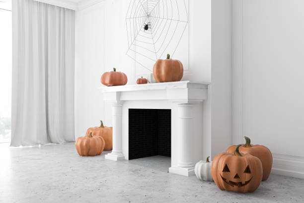 istock White fireplace with carved pumpkins, side view 1272276898