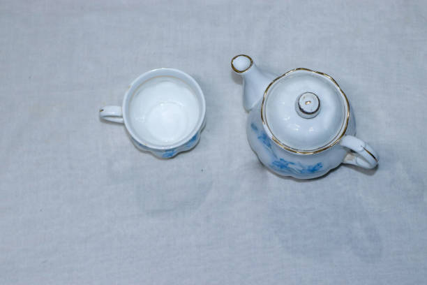 istock Empty tea and saucer with rose petals 1272280510