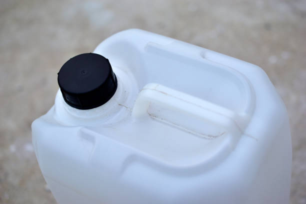 istock White plastic canister with a black cap on the concrete 1272281809