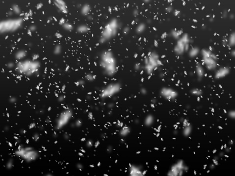 Falling snowflakes on black background stock illustration.