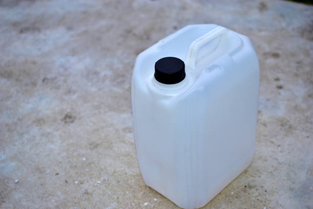 istock White plastic canister with a black cap on the concrete 1272282224