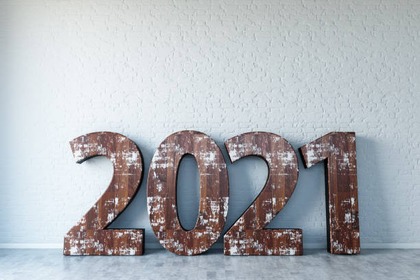 istock Wooden 2021 Sign Against Brick Wall 1272284814