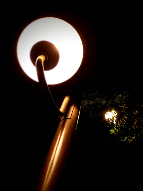 istock Low angle of a street lamp on a dark night 1272287217