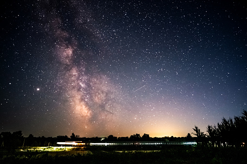 Milky Way Over Express Train at night sky.