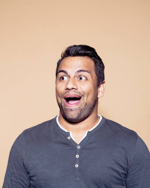 istock Cheerful entrepreneur against brown background 1272288240