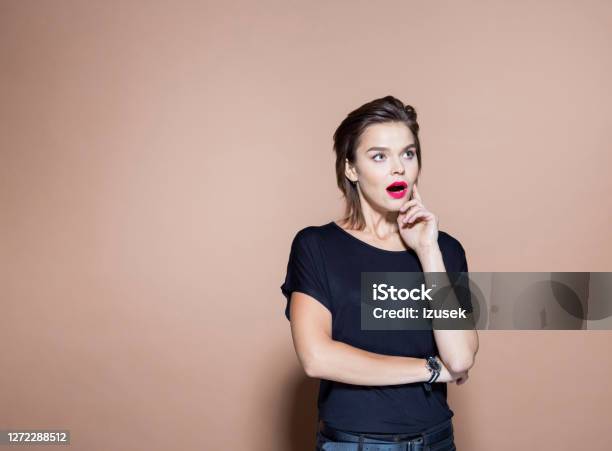 Shocked Businesswoman Against Pink Background Stock Photo - Download Image Now - Surprise, Businesswoman, Individuality