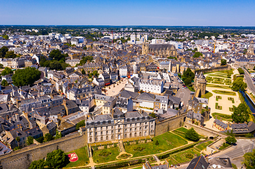 Drone view of Vannes overlooking fortified city walls and lawns with floral design, Brittany, France