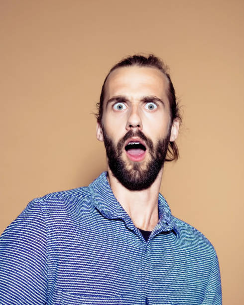 istock Shocked businessman over colored background 1272293618