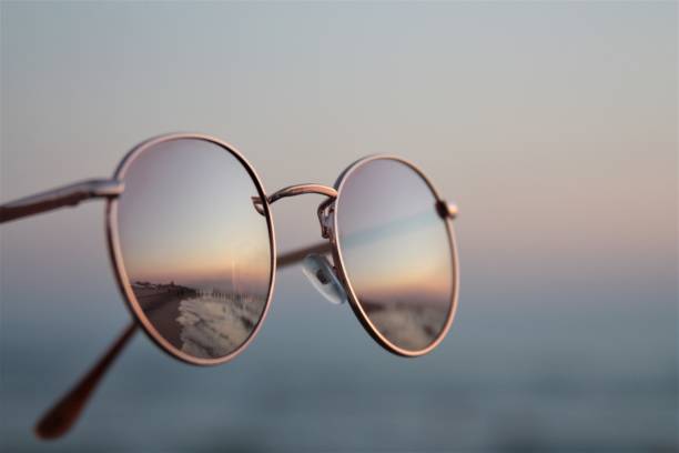 istock sunset reflection in sunglasses pastel colors summer time tourism 1272293772