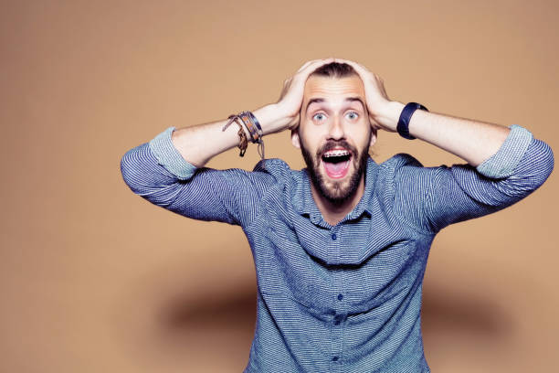 istock Excited businessman against brown background 1272294638