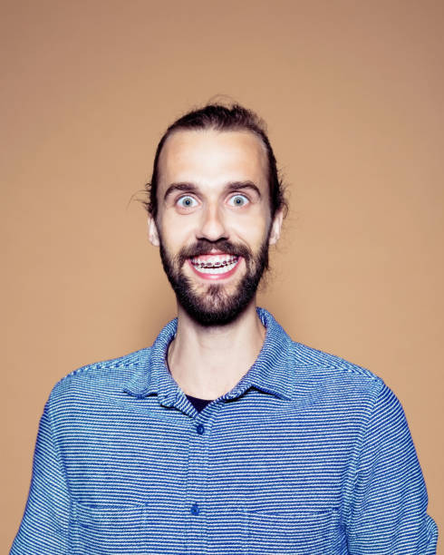 istock Entrepreneur showing braces over brown background 1272294701
