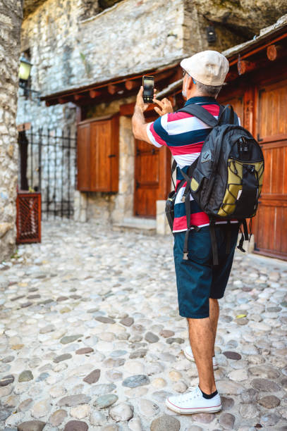istock Capturing his travel experience on the street Mostar 1272294827