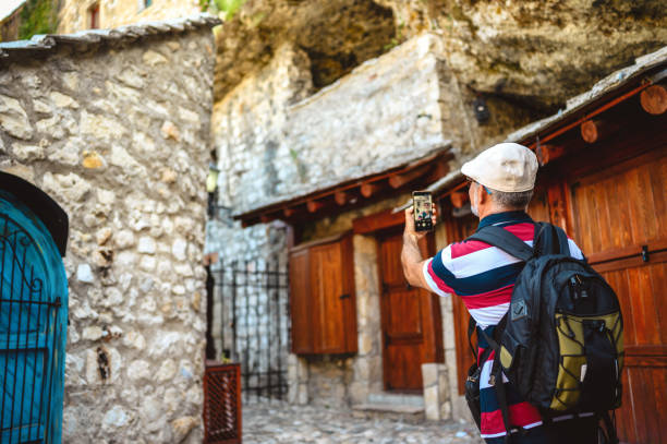 istock Capturing his travel experience on the street Mostar 1272294934