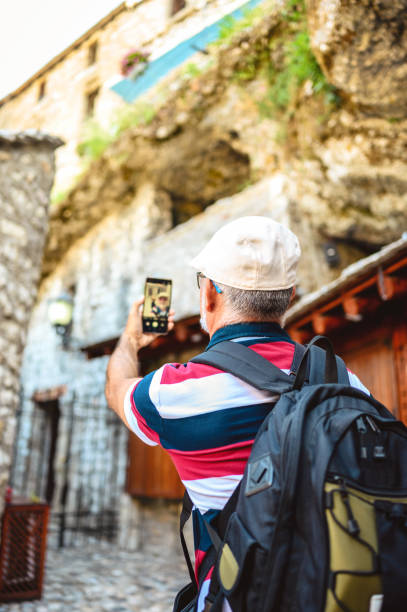 istock Capturing his travel experience on the street Mostar 1272295091
