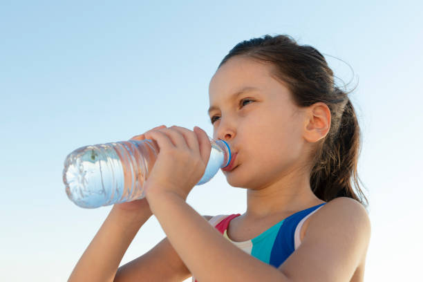 istock Girl Drinking Water 1272295207