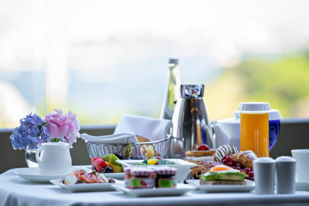 istock plates with assorted breakfast meal on a white table in a hotel room 1272297505