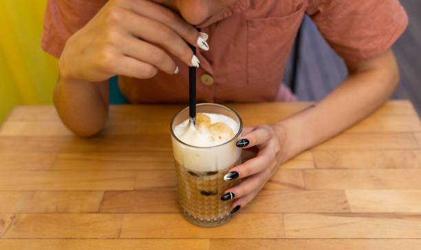 istock Women drinking cup ice coffee latte 1272297551
