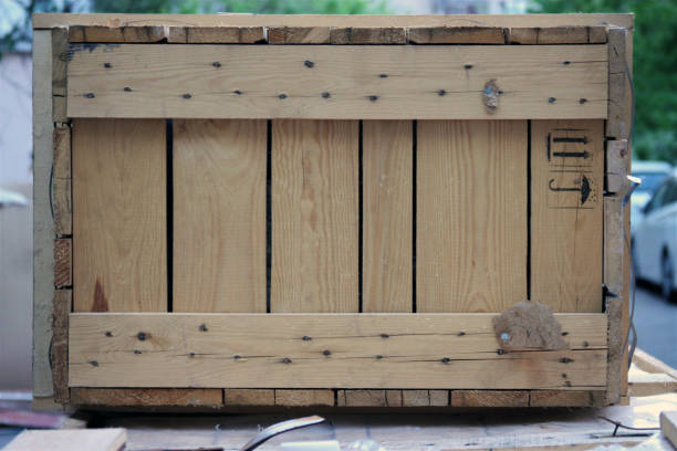 istock wooden boarded up box container close up 1272297698
