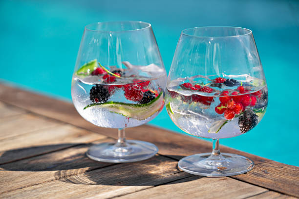 istock Cocktail with berries near the swimming pool 1272297736