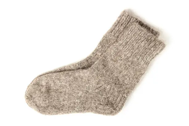 Warm knitted woolen socks isolated on white background