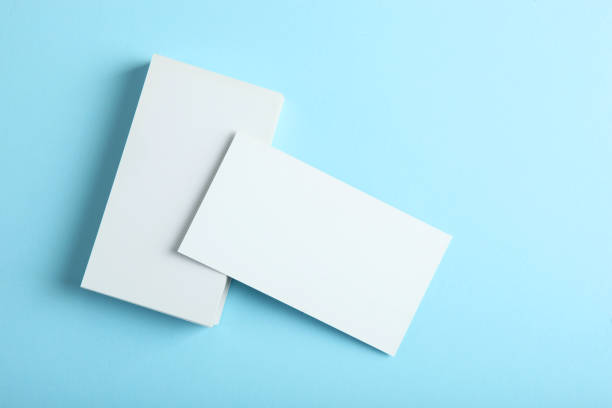istock business cards on a colored background top view. Place to insert text 1272300310