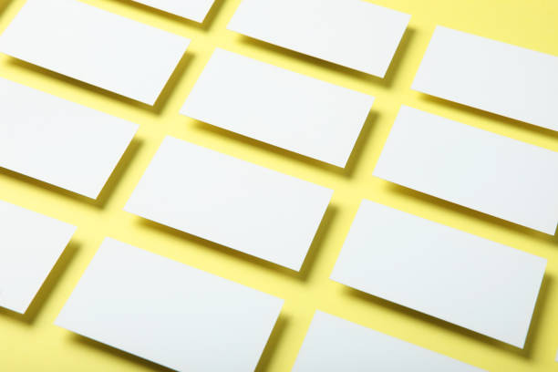 istock business cards on a colored background top view. Place to insert text 1272300317