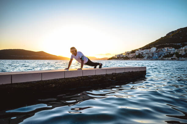 istock Man push up workout outside by the sea 1272300668