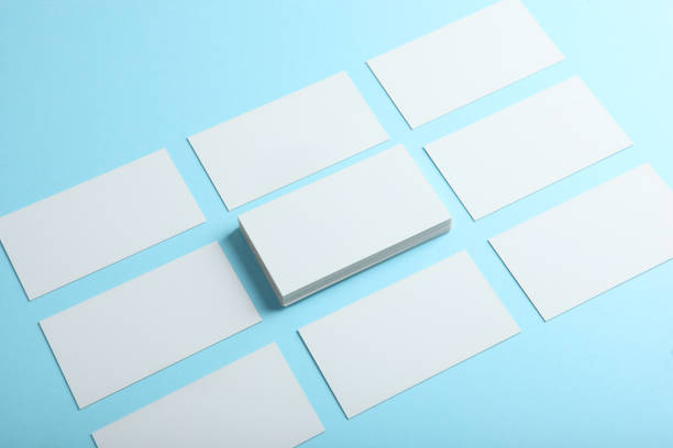 istock business cards on a colored background top view. Place to insert text 1272300701