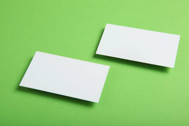 istock business cards on a colored background top view. Place to insert text 1272301611