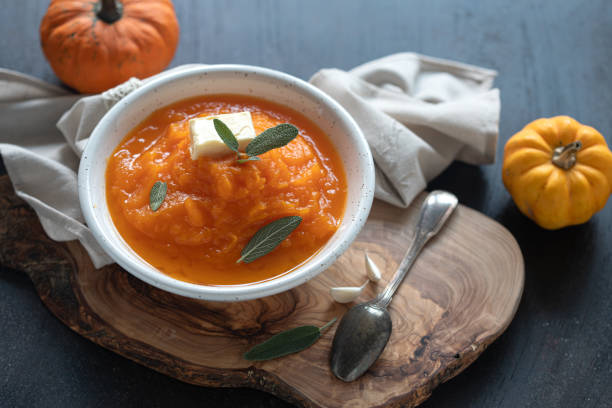 istock Homemade pumpkin cream soup with sage 1272301853