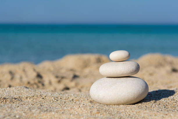 istock Balanced pebbles on a the beach, close up 1272302718