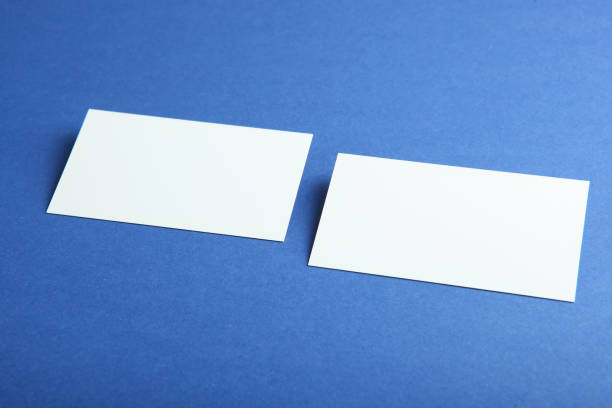 istock business cards on a colored background top view. Place to insert text 1272303055