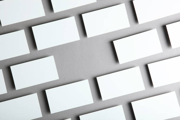 istock business cards on a colored background top view. Place to insert text 1272303796