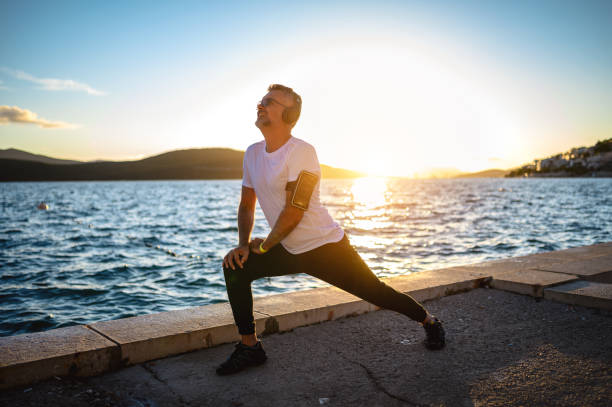 Man stretching on the shores stock photo