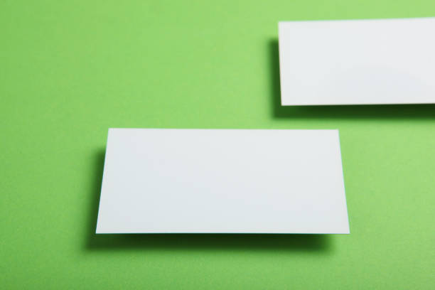 istock business cards on a colored background top view. Place to insert text 1272303847