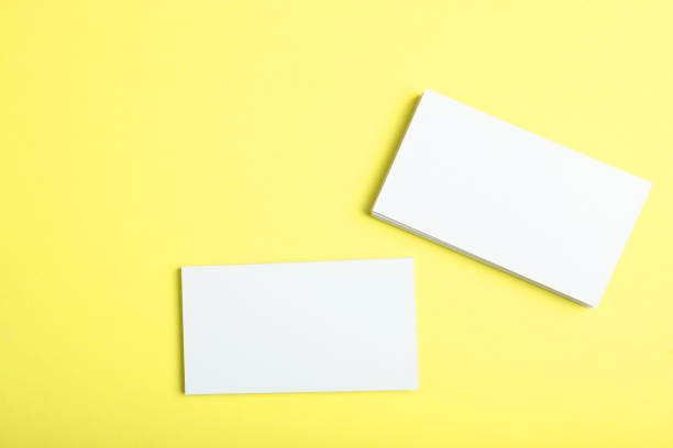 istock business cards on a colored background top view. Place to insert text 1272303942