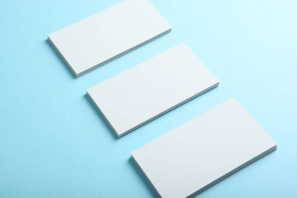 istock business cards on a colored background top view. Place to insert text 1272303977